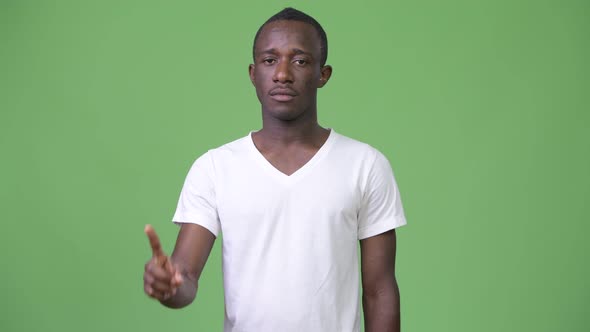 Young African Man Pointing Up alt