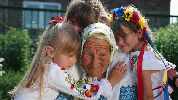 An Old Grandmother is Sitting on the Street and Reading a Book alt