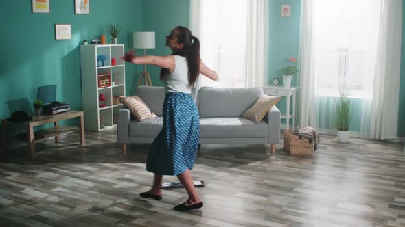 Young Woman Is Dancing with Mop