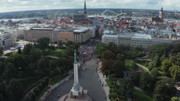 Aerial View on Crowd of People Who are Running a Marathon in Riga alt