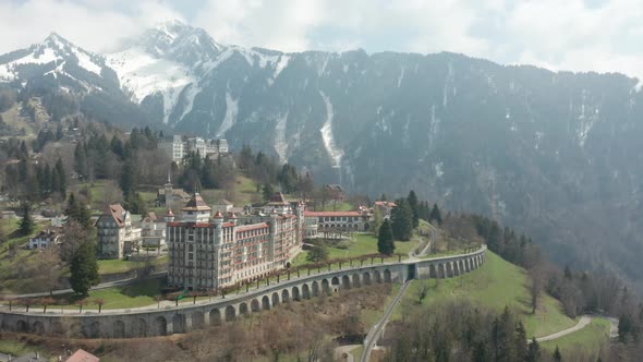 Aerial of beautiful hotel located in hills in Montreux, Switzerland alt