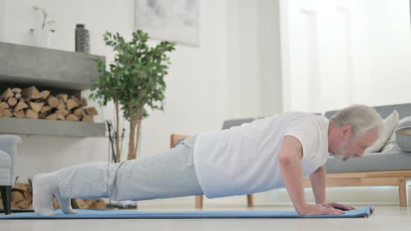 Old Man Doing Pushups on Yoga Mat at Home alt