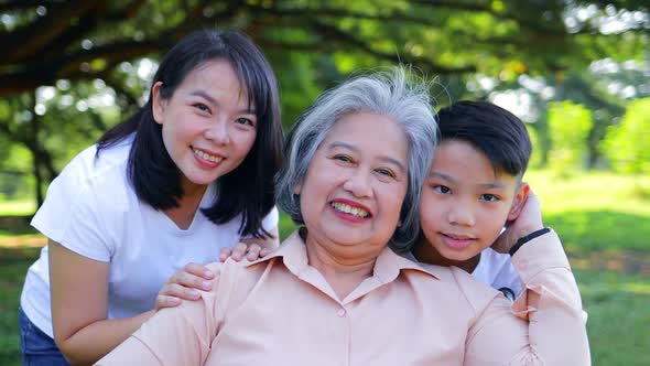 Asian family concept. Grandma, mother and little son Come and relax in the park alt