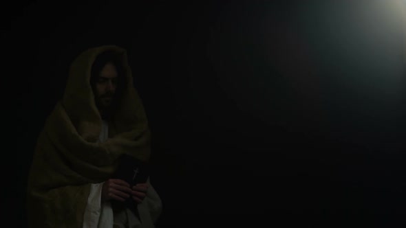 Jesus Coming Out of Darkness and Giving Holy Bible, Concept of Belief in God alt