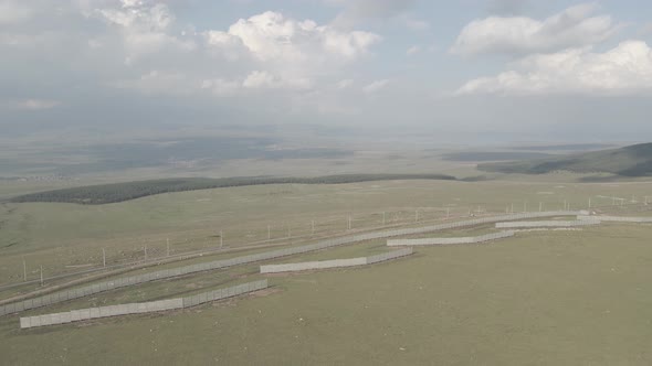 Samtskhe Javakheti, Georgia - August 28 2021: Aerial view of Snow protection fences near railroad. alt