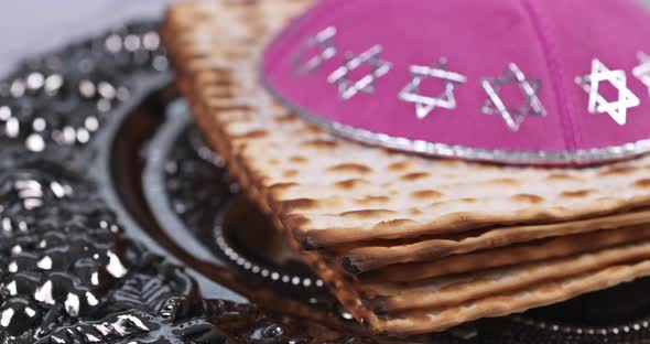 Pesach Israeli matzah bread for Jewish holiday with holy religious book in the torah scroll alt