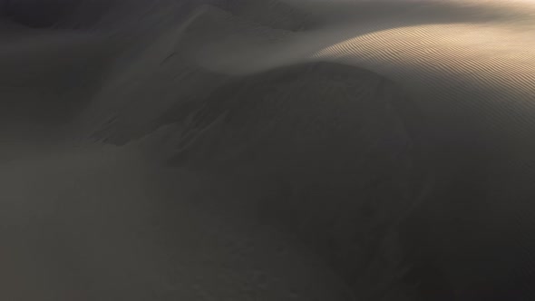  Aerial Drone View Flying By Beautiful Wavy Sand Dunes in Golden Sunset Light alt