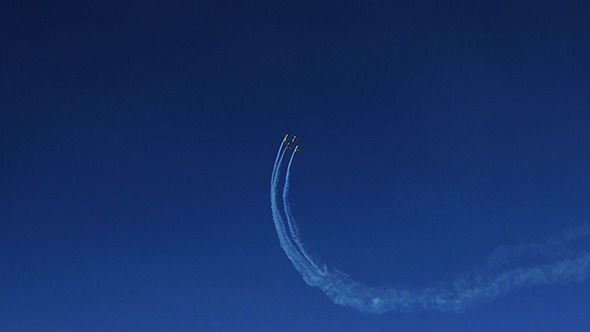 Airplanes Doing Tricks on Blue Sky Background 3 alt
