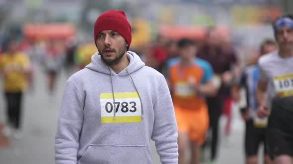 Portrait Face of Tired Athlete Runner on Marathon Standing Looking at Camera