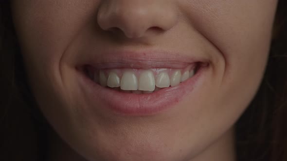 Close Up of a Caucasian Woman Confident Smile in Slow Motion alt