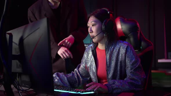 At Night in the Computer Club a Young Girl From Asia Stayed Late the Administrator Shows Her That alt