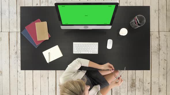 Young Successful Woman in Glasses Sitting at Table with Computer alt