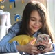 Happy Child is Mobile Teenage Girl Koristim a Smartphone Axes the Social Network Read Messages - VideoHive Item for Sale