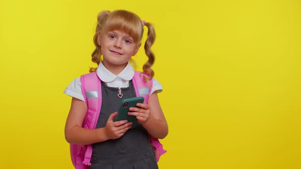 Girl Kid in School Uniform Using Mobile Phone Typing New Post Sms Message Browsing Social Networks alt