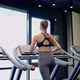 Fit Woman Running on Treadmill - VideoHive Item for Sale