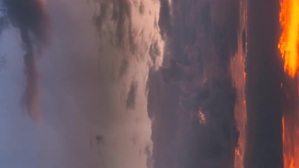 Vertical Shot  Sunset Cloudy Sky With Fluffy Clouds alt