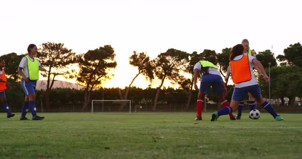 Female soccer players passing the ball while playing in different teams. 4k alt