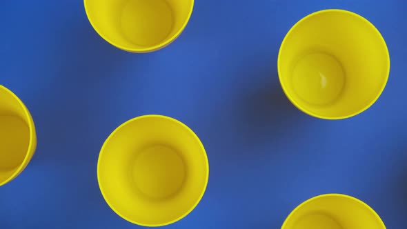 Flat Lay Food Background with Empty Yellow Cup, Over Blue Background alt