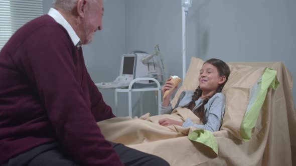 Girl Lie on the Bed, Eat Icecream and Talk To Her Grandfather alt