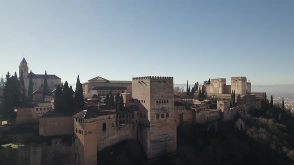 Alhambra citadel and cityscape, Granada in Spain. Aerial circling. Sky for copy space
