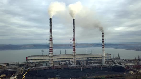 Aerial View of High Chimney Pipes with Grey Smoke From Coal Power Plant alt