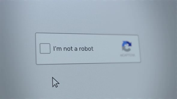 Mouse clicking on I'm not a robot button on a computer screen confirming that the user is human.
