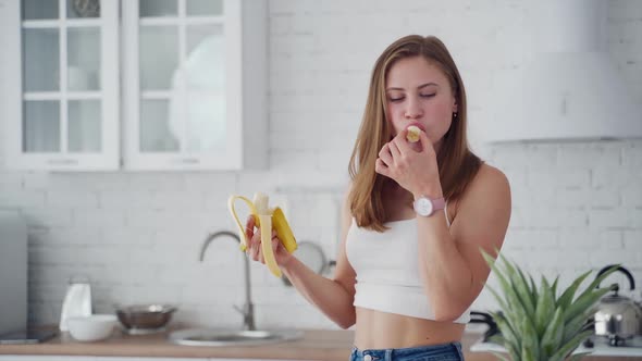 Pretty Woman Enjoys Eating Banana Stock Footage Videohive