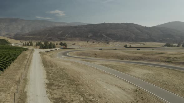 Aerial footage 4krs driving on a racing circuit, Osoyoos race track, Luxury Motorsports Club, Canada alt