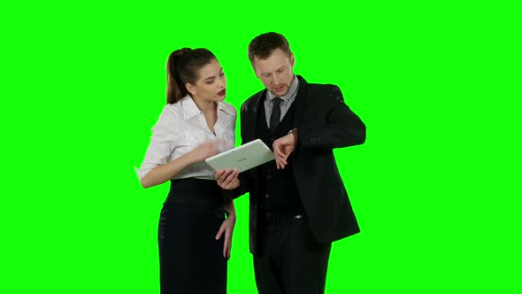 Two Office Worker Look at a Laptop Together, Green Screen alt