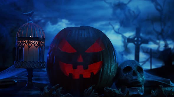 Scary laughing pumpkin and an old skull over the frightening gothic background. alt