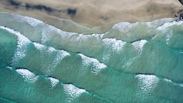Top down view on the tropical sand Beach with Splashing Sea Waves,Norway