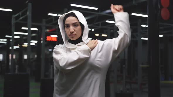 Young Muslim Woman is Focused on Fitness a Woman Does Sports in the Gym