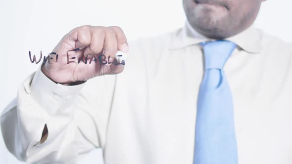 Asian Businessman Writes Wifi Enabled alt