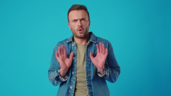 Young Caucasian Man Shows Gesture Its Not Me Against Blue Background