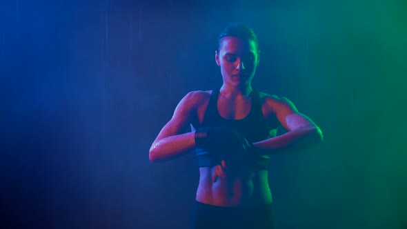 Woman Binding Bandage on Hand, Rain alt