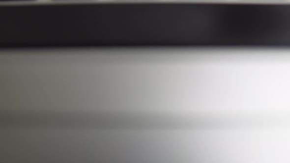 Close-up macro panoramic view of keyboard on the laptop computer. Slow macro soft focus dolly shot. alt