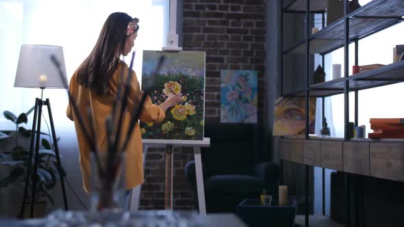Young Asian Female Artist Creating a Painting alt