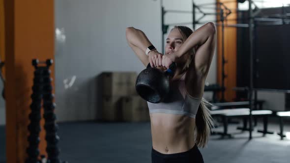 Athletic Woman in Gym Girl Lifts the Weight Muscle Training with Weights Crossfit alt