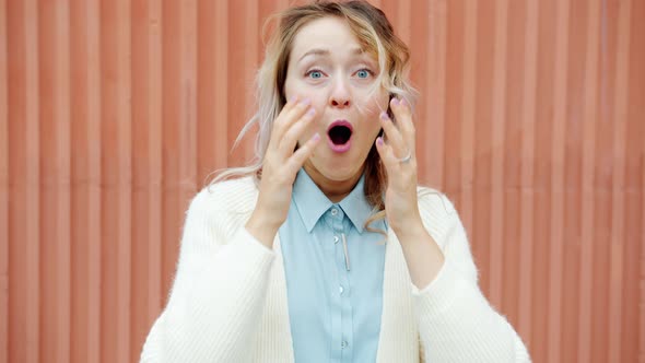 Slow Motion of Ecstatic Lady Screaming Expressing Happiness and Joy Outdoors alt