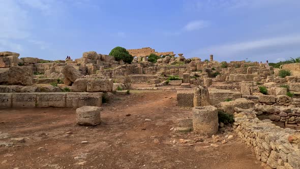 Moving scenery of tourists at Selinunte archaeological park in Sicily, Italy. Slow motion alt