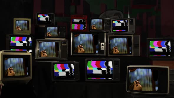 Hands of a Man playing a Harp on Retro Televisions.