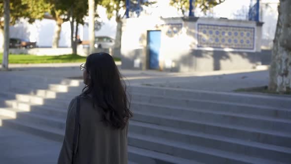 Caucasian woman walking in slow motion in Arraiolos traditional village streets in Alentejo alt