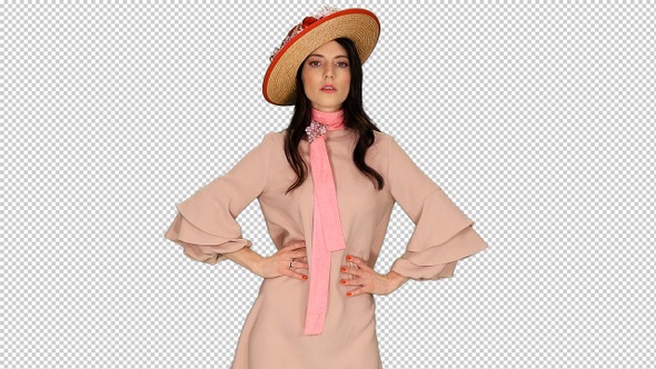 Charming young brunette lady in pink dress and straw hat posing, Alpha Channel