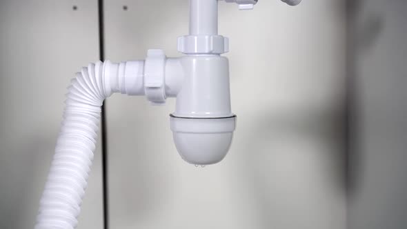 Leaking Siphon Under the Sink alt