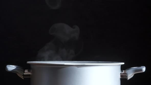 Steam Curls Gracefully From The Pan