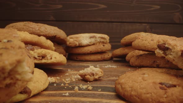 Macro Zoom in Video of Crispy Oat Cookies on Wooden Board in Kitchen