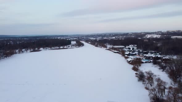 Aerial Kharkiv, frozen Lopan river with epic sky