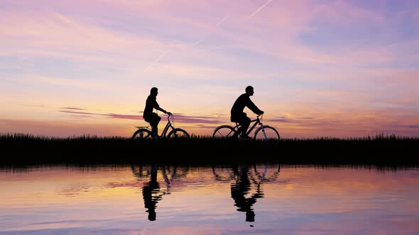 Silhouette Of a Cyclists At Sunset