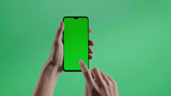 Hand Tap Touch Green Screen Smartphone On The Green Screen Background alt