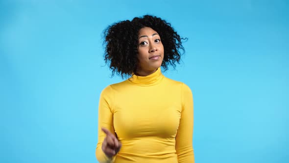 Portrait of Serious African Woman Showing Rejecting Gesture By Stop Finger Sign alt